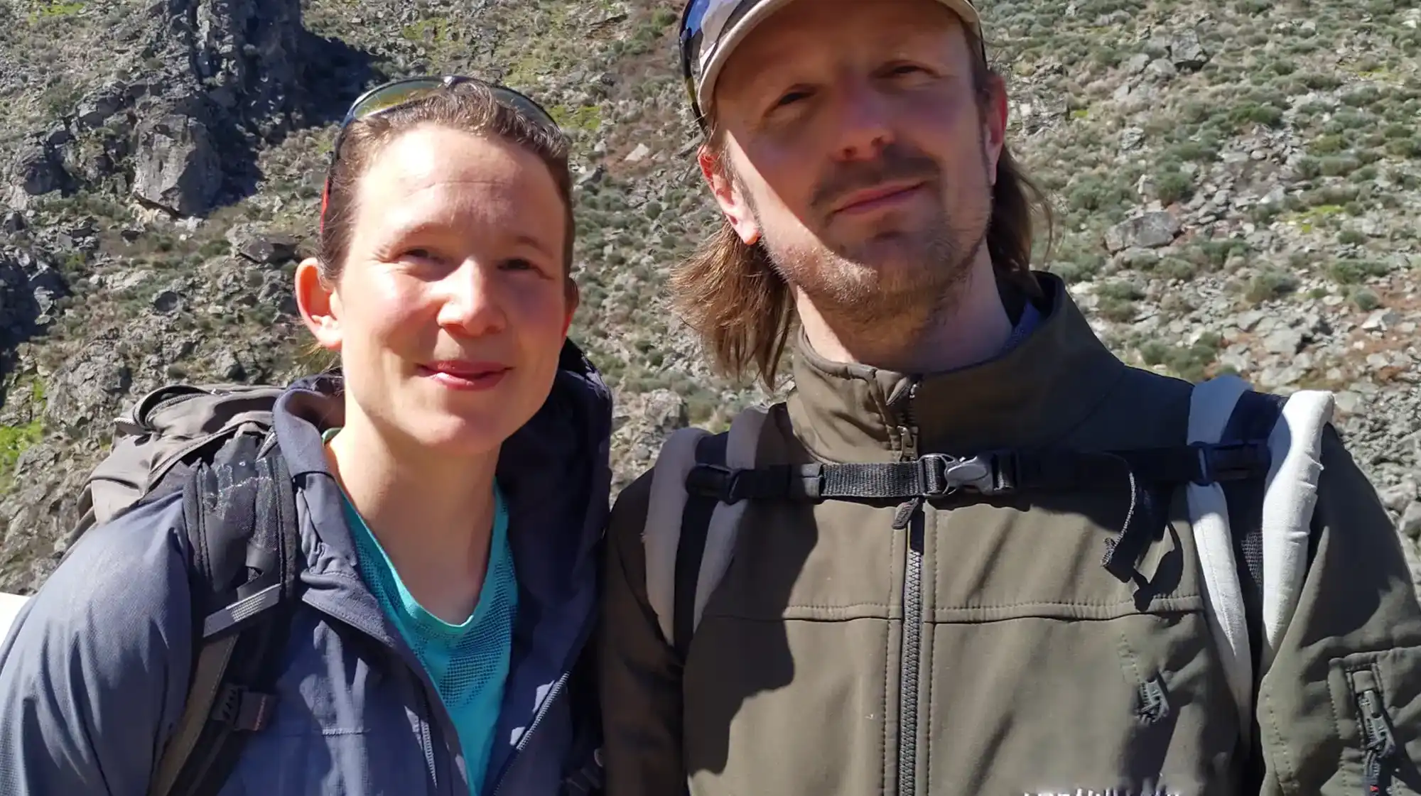 Frank & Janneke, A friendly portrait of Frank and Janneke in front of Starbase18, with tools, plants, and renewable systems representing their skills and passions.