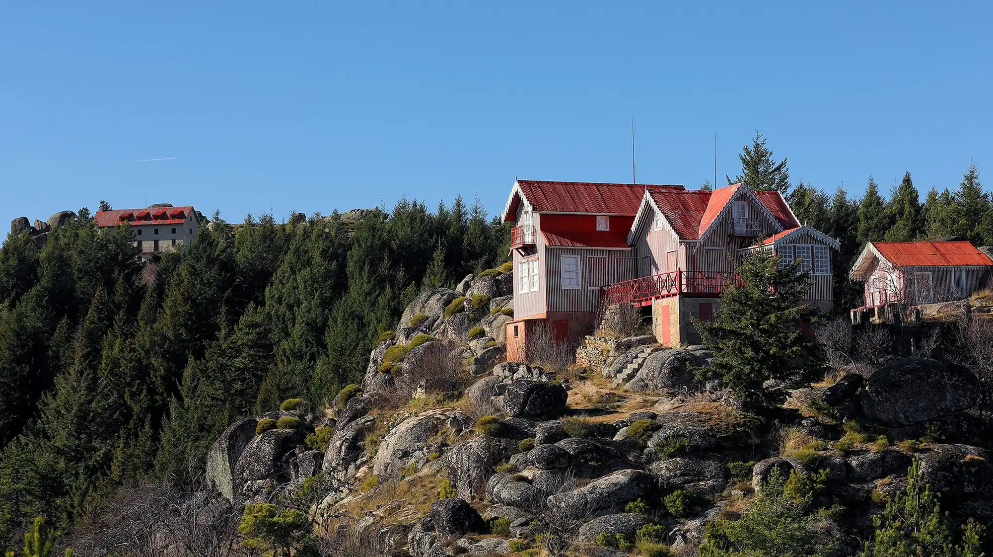 Penhas Douradas mountain resort village with panoramic snow views