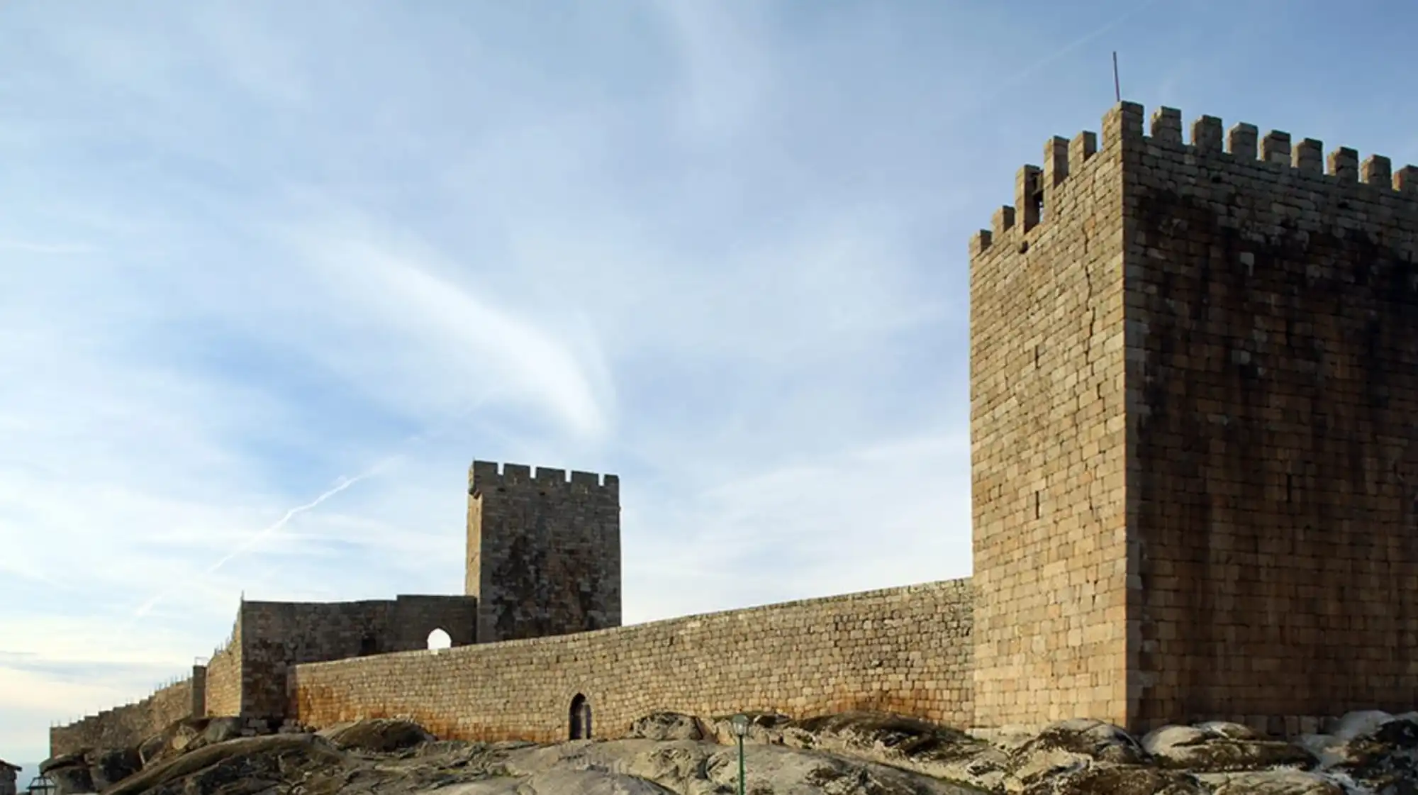 Linhares da Beira’s castle and Romanesque architecture with mountain backdrop