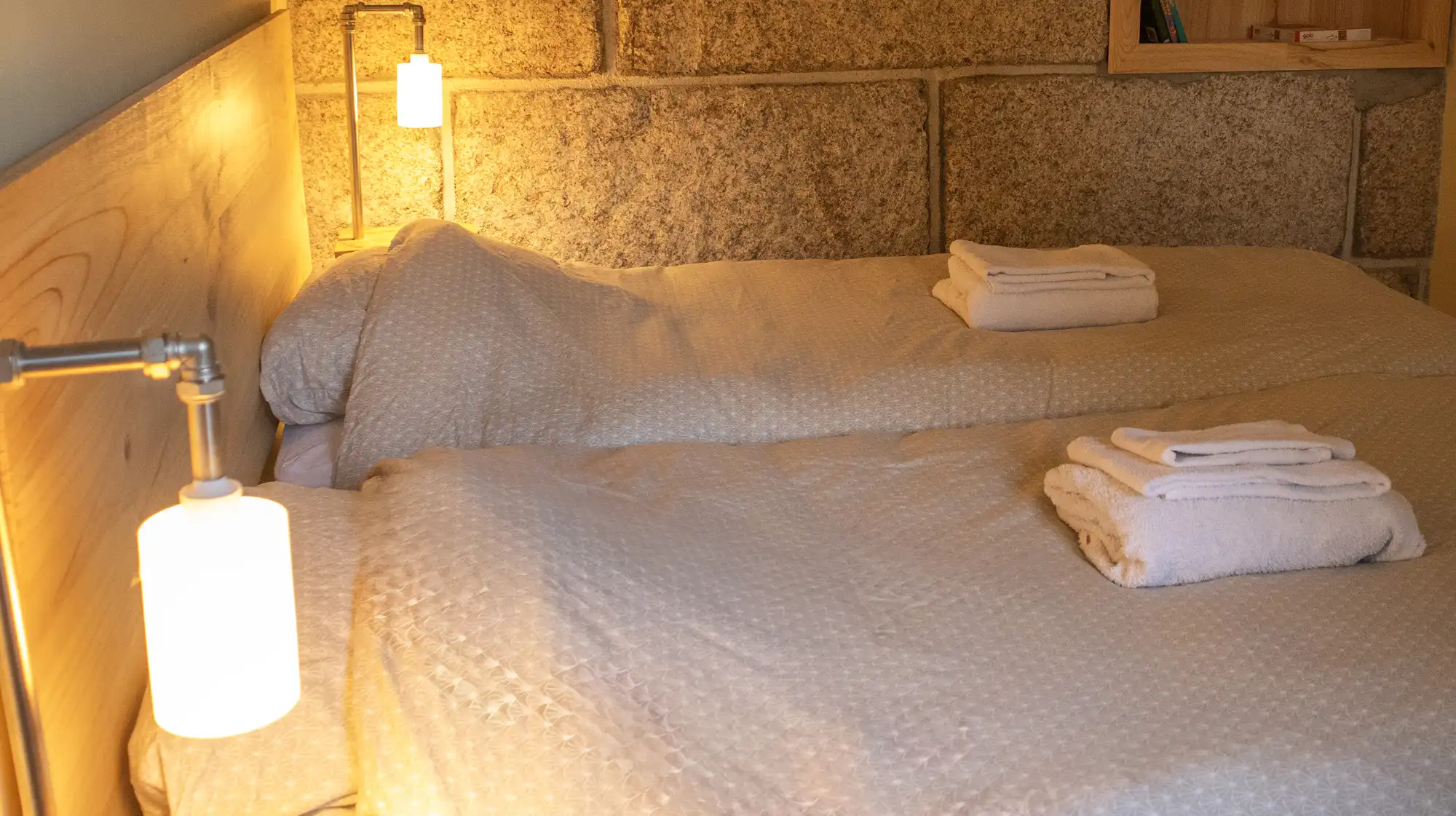 A cozy bedroom with a view of the mountains.
